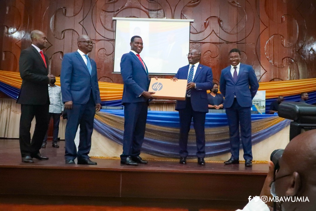 Vice President Dr. Mahamudu Bawumia makes symbolic presentation of one of the laptops to School authorities