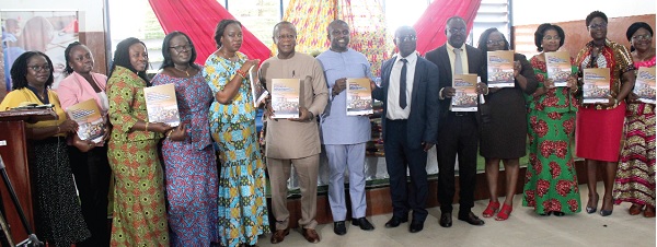 Sheila Naa Boamah (5th from left), Technical Advisor, Ministry of Education, displaying the book. With her are  Rhoda Enchil (2nd from left), Education Officer, UNICEF;  Bernice Aduo Addae (3rd from left), Director, SPED;  Prof. Emmanuel Kofi Gyimah (6th from right), Lead Consultant for the Disability Trust Fund Project; Dr Kwabena Bempah Tandoh (7th from right), Dep. Director, GES, and some officials. Picture: ERNEST KODZI