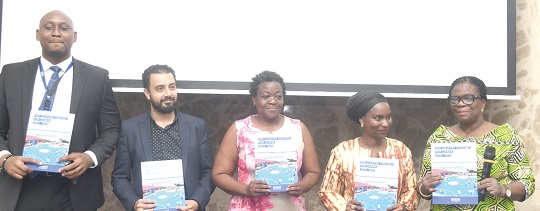From left: Nnamdi Iwuora, Senior Programme Manager of IOM; David Shokry, Resource Management Officer of IOM; Myra Togobo, Officer in charge of Data Management, Evaluation and Registration at the Office of the United Nations Resident Coordinator; Abibatou Wane, the IOM’s Chief of Mission for Ghana, Benin and Togo, and Adelaide Anno-Kumi, Chief Director of the Ministry of the Interior, diplaying the IOM Ghana Country Strategy for 2022 to 2025 at the launch in Accra