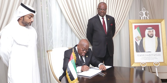 President Akufo-Addo signing the Book of Condolence for Sheikh Khalifa Bin Nahyan, former President of UAE. With him are Amer Al Alawi (left), Charge d'Affaires of the UAE in Ghana, and Kwaku Ampratwum-Sarpong, Deputy Minister of Foreign Affairs. Picture: SAMUEL TEI ADANO