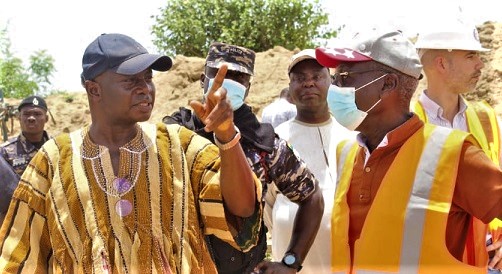 Stephen Yakubu (left), the Upper East Regional Minister, interacting with Peter Dagadu (right), the consultant on the project, during the visit. 