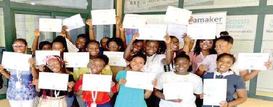 Graduating trainees displaying their certificates