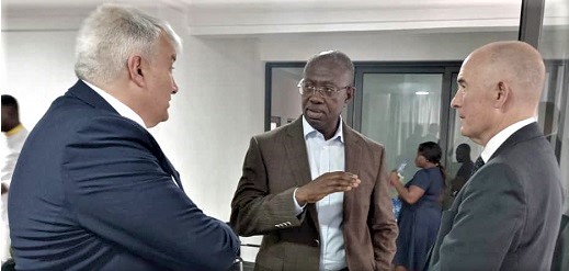 Kwabena Bonsu Fordwor (middle), Chief Executive Officer of GIISDEC, interacting with John Lester (left), Vice-President of CISDI Engineering. With them is Howard R. Barnes, Managing Partner of Intercon