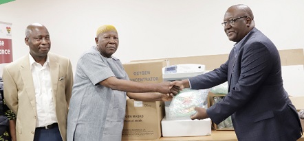  Dr Francis Kasolo (right), WHO Country Representative, presenting the equipment and supplies to Mahama Asei Seini, Deputy Minister of Health. Picture: EDNA SALVO-KOTEY