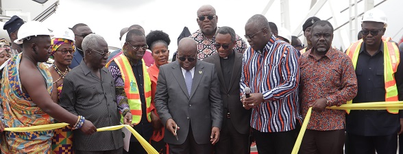 President Akufo-Addo cutting the tape to commission the dredging equipment near Ashaiman in Accra. Those with him are Yaw Osafo-Maafo (2nd from left), Senior Advisor to the President; Joseph Siaw Agyapong (3rd from left), Executive Chairman, Jospong Group of Companies; Francis Asenso-Boakye (right), Minister of Works and Housing, and Kwaku Asiamah (2nd from right), Minister of Transport. Picture: SAMUEL TEI ADANO