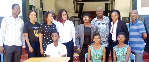 Lydia Mamle Bantey (4th from right), Assistant Headmistress of Achimota School; Eunice Amewu Nyadu (2nd from right), the OAA ’92 President, and some OAA '92 executive, staff members and students after the donation