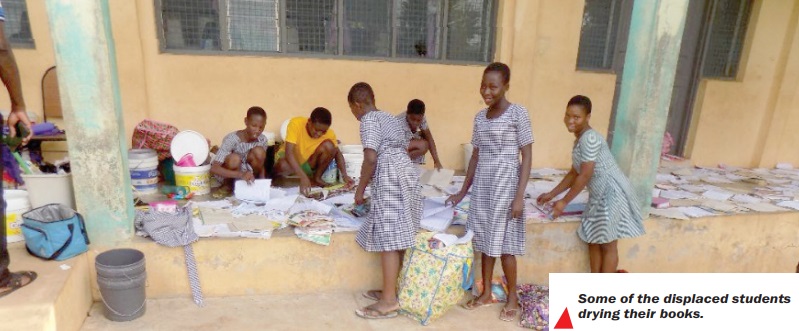 Some of the displaced students drying their books