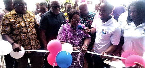 Frema Osei Opare (middle), Chief of Staff at the Presidency, cutting the tape to inaugurate the building. With her are Dr Ismael Ackah (2nd from right), Executive Director of the PURC; Ebo Quagrainie (2nd from left), Board Chairman of PURC, and Seth Kwame Acheampong (left), Eastern Regional Minister, as well as Members of Parliament and Municipal Chief Executives.