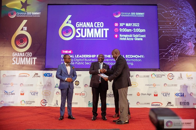 Felix Gomis receives the award from Vice President Dr. Mahamudu Bawumia, while Ernest De-Graft Egyir - Executive Director of CEO Network (left), looks on