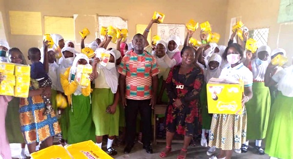 Puplis of Effiduasi Asokore Ahmadiyya Islamic School showing appreciation for a donation of sanitary pads to them by Mano Pad Fund