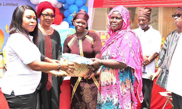 Esther Adomako (left), Chief Executive Officer, Trans-National Insurance Brokers Ltd being assisted by Joyce Thompson (2nd from left), Former Director of Legal and International Relations, Ghana Civil Aviation Authority to present the items to Aisha Mohammed (right), Queen Mother, Mallam Attah Market Kayaye. Picture: ELVIS NII NOI DOWUONA