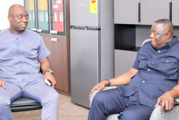 Justin Frimpong Kodua (left), NPP General Secretary, in a chat with Lawrence Agyinsam, Chief Executive Officer of the Ghana Export Import Bank, during his visit to the NPP headquarters 