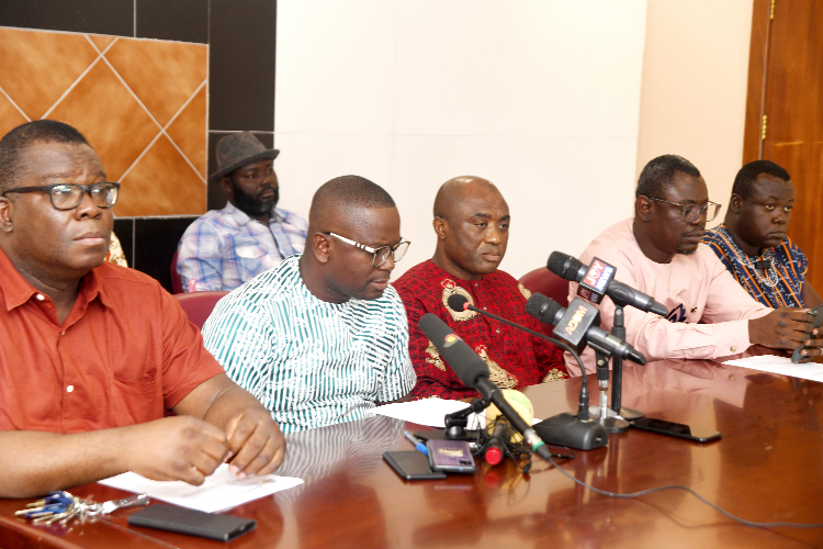 Rev. Isaac Owusu (2nd from left), President of GNAT, addressing the press conference on behalf of the unions. With him include Angel Carbonu (left), President of the National Association of Graduate Teachers, Thomas Musah (3rd from left), General Secretary Of GNAT