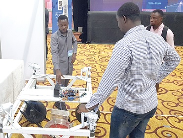 Some participants inspecting digital products at the various exhibition stands at the Ghana Digital Innovation Week. Picture: ERNEST KODZI