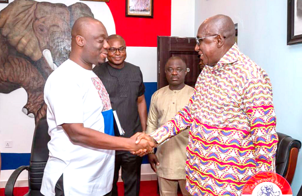 Justin Frimpong Kodua (left), NPP General Secretary, welcoming Ambrose Dery, Minister of the Interior, to the party headquarters 