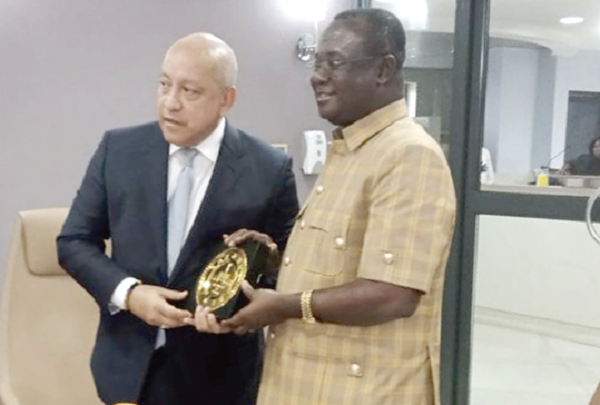 Joseph Osei-Owusu (right), First Deputy Speaker of Parliament,  presenting a plaque  to Crispiano Adames, President of the National Assembly of Panama