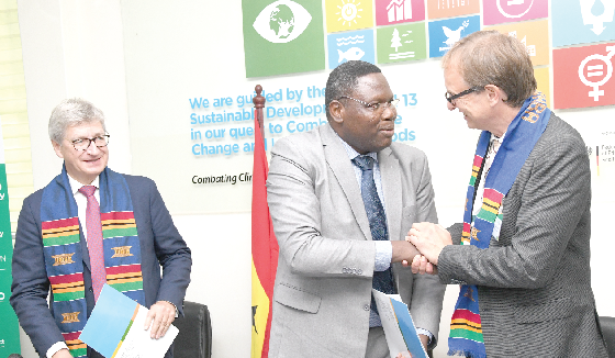 Dr Moumini Savadogo (middle), Executive Director of WASCAL Ghana, interacting with Prof. Letmathe (right), FZJ Board Chairman of WASCAL, after signing the MOU. Wth them is Prof. Wolfgang Marquardt. Picture: EBOW HANSON 