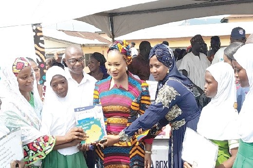 Hajia Samira Bawumia (middle), the Second Lady, Hajia Latifah Abdul Rahaman (3rd from right), Headteacher of Apimpoa Islamic Basic 'A' and Fati Nasamu Hatong (left), Headteacher of Apimpoa Islamic School 'B' together with the schoolchildren