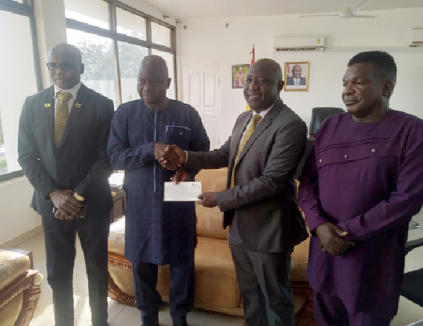  Alhaji Mohammed Mipo, GCB Bank Regional Manager in charge of the five northern regions (2nd from right) presenting a cheque to Stephen Yakubu, the Upper East Regional Minister (2nd from left). Looking on are Sheihu Abdulai, GCB Branch Manager, Bolgatanga, and Jerry Asamani, the Upper East Regional NADMO Director