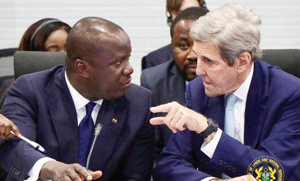  Mr Samuel Abu Jinapor (left), Lands and Natural Resources Minister, interacting with John Kerry, the US Special Envoy on Climate, during the first meeting of the Forests Climate Leader Partnership meeting
