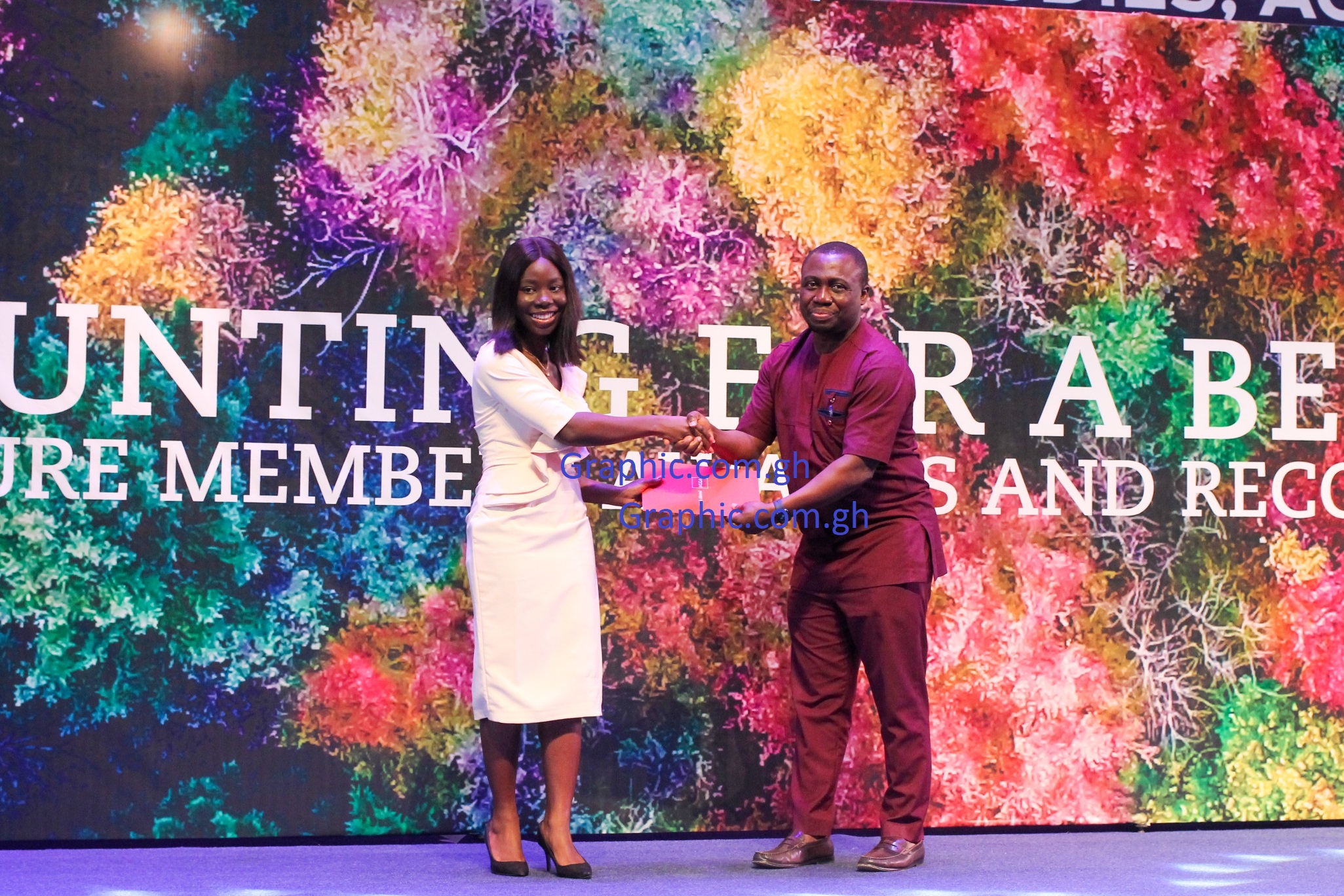  Nana Adwoa Oduraa Asomaning-Agyei receiving one of her awards from Abeeku Gyan Quansah, a Partner at PwC Ghana, during the ACCA Future Members Awards and Recognition 2022. Picture: Maxwell Ocloo