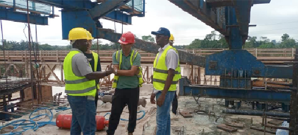 Officials of GHA interacting with company officials at the project site
