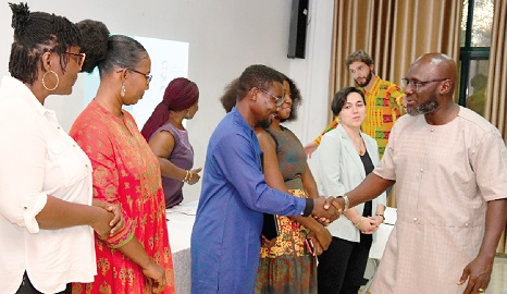 Nana Agyenim Boateng (right) congratulating the executive members of the Foundation after having been sworn into office. Picture: EBOW HANSON