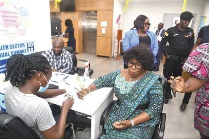 Tina Mensah, Deputy Minister of Health, being  tested for blood sugar at the commemoration of World Diabetes Day in Accra  