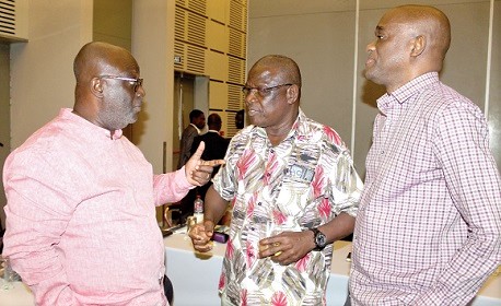Kwesi Korboe (left), Chief Executive Officer of GIRSAL, in a chat  with Prof. Emmanuel Y. H. Bobobee (middle) of the Agricultural Engineering Department of the KNUST, and Chris Quashie (right), Chairman of GICSP. Picture: ESTHER ADJORKOR ADJEI