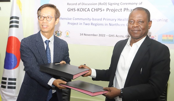 Mooheon Kong (left) Country Director of KOICA Ghana Office exchanging the signed agreement with Dr Patrick Kuma Aboagye (right), Director General of the Ghana Health Service at the ceremony in Accra.