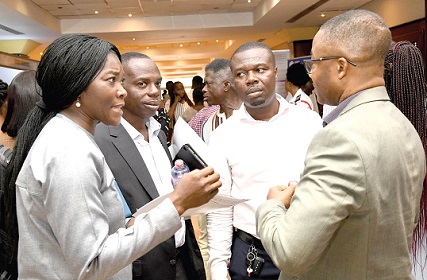 Dr Faustina Frempong-Ainguah (left), Deputy Government Statistician, interacting with some participants in the Data Fair held by the Ghana Statistical Service  in Accra. Picture: EBOW HANSON