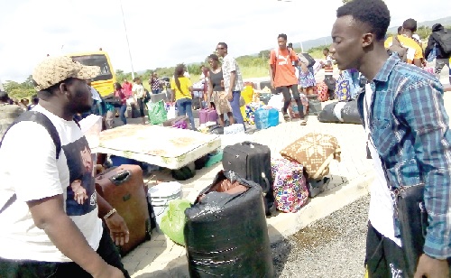 The students with their luggage getting ready to move into their various communities