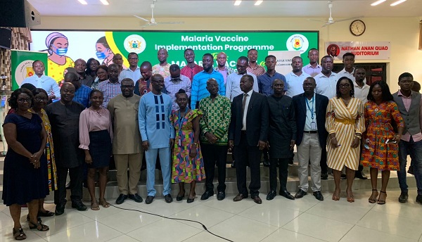 Officials of Ghana Health Service, PATH and some media personnel in a group photo after the media briefing on the malaria vaccine expansion project in Accra