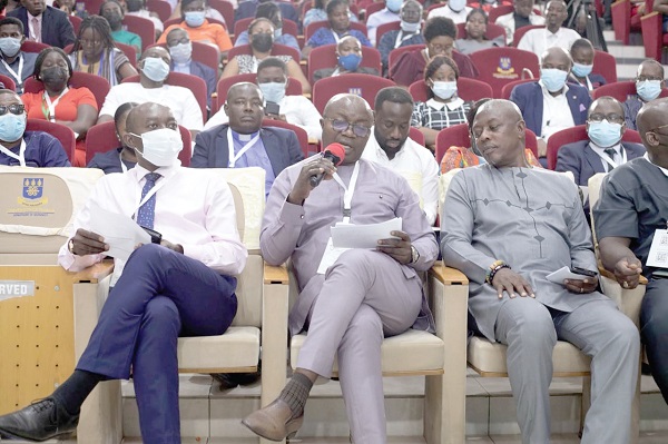 Osei Assibey Antwi (middle), Executive Director, NSS, addressing participants while Ambrose Entsiwah Jnr (right), Volta Regional Director of NSS, looks on