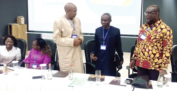Dr Argata Guracha Guyo (3rd from right), Representative of the WHO, interacting with Dr Franklin Asiedu-Bekoe, (2nd from right), Director Public Health, GHS, and Seji Saji (right), Deputy Director-General of NADMO, at the workshop. Picture: BENJAMIN XORNAM GLOVER