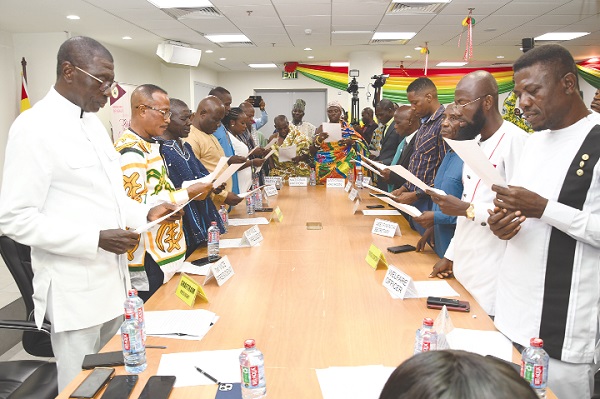 Prof. Duncan (left) with the newly elected executive members of Ghana Federation of Traditional Medicine Practitioners Association swearing the oath of office. Picture: EBOW HANSON