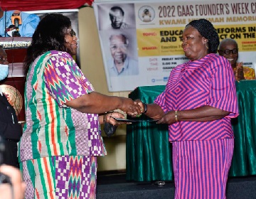 Prof. Jane Naana Opoku-Agyemang (right) receiving the commemoration certificate from  Prof. Henrietta Mensa-Bonsu, a Justice of the Supreme Court