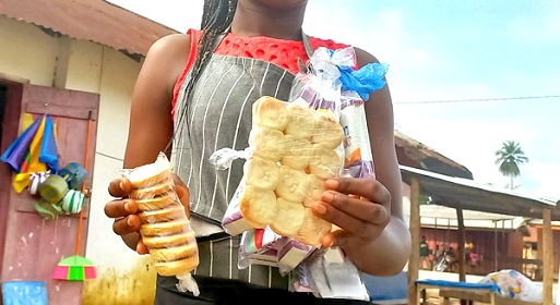 A hawker displaying some of the biscuits