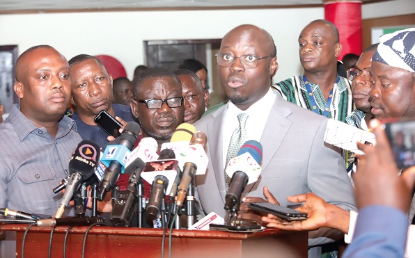  Dr Cassiel Ato Forson (right), Minority Spokesperson on Finance, addressing the media after the budget presentation