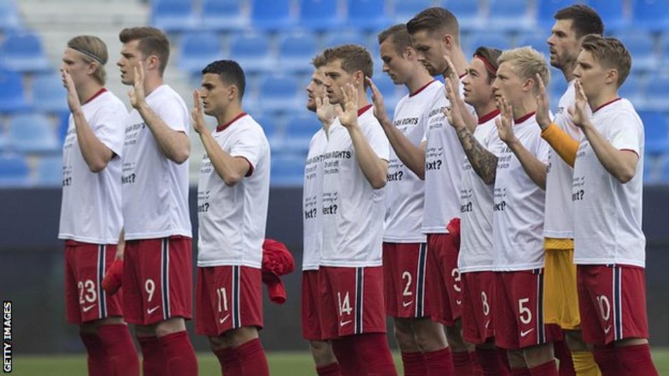 Norway players, including Erling Haaland (far left), wore shirts last year saying 'human rights on and off the pitch' in protest of the Qatar World Cup. Norway have not qualified for the tournament.