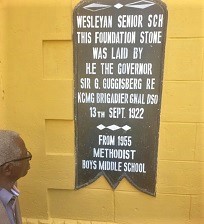 The plaque at the entrance of the school