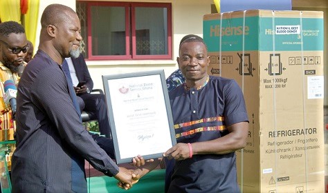 Dr Ignatius Awinibuno Achor (left), Director, Allied Health, Ministry of Health, presenting an award to Isaac Teye Odonkor, the National Best Blood Donor, 2022. Picture: ESTHER  ADJORKOR ADJEI