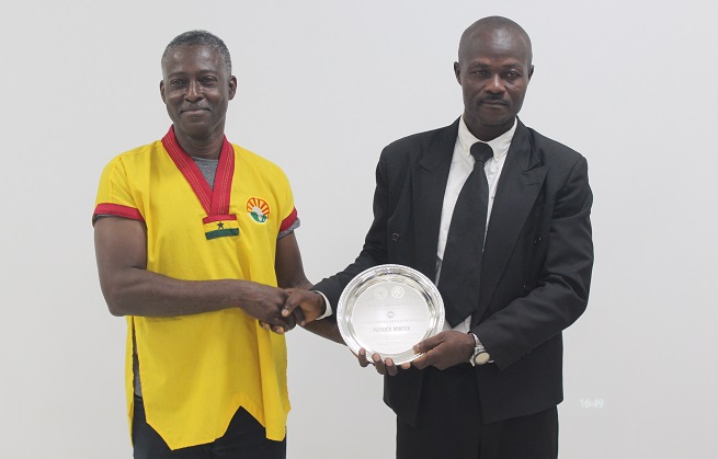Patrick Mintah (left), Martial Artist of the Year receiving his prize from Donald Gwira.
