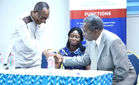 Mawutor Ablorh (left) exchanging pleasantries with Barnabas Yisa. With them is Vera Bediako Karikari, a Deputy Director, Department of Gender.