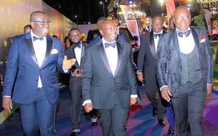 Vice-President Dr Mahamudu Bawumia (middle) in the company of Ernest  Ofori Sarpong (right), CEO Special Ice Company Limited and Samuel Awuku (left), Director General, National Lottery Authority at the EMY Awards