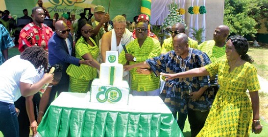 Anastasia Konadu (arrowed), the Headmistress of Ebenezer SHS, and other dignitaries cutting the anniversary cake.