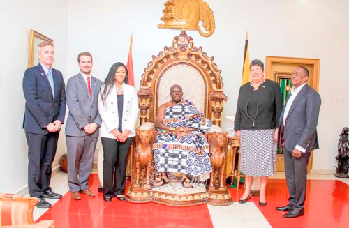 Otumfuo Osei Tutu II (seated) with Virginia E. Palmer (right), the US Ambassador to Ghana, and some members of the US Embassy delegation