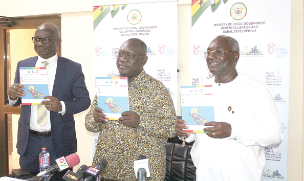 O.B. Amoah (middle), Deputy Minister of Local Government, Decentralisation and Rural Development, with Dr Kodjo Mensah-Abrampah (right) and Abdulai Abanga, Deputy Minister of Works and Housing, after the launch of the 2022 report on the implementation of the New Urban Agenda in Accra