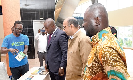 Samuel Abu Jinapor (3rd from right), Minister of Lands and Natural Resources, with Richard Razaaly (2nd from right), EU Ambassador to Ghana, looking at some products made from cocoa during an exhibition to mark the Orange Cocoa Day 2022. Picture: EBOW HANSON