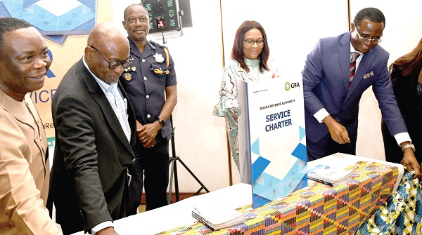 Stella Williams (2nd from right), Co-ordinating Director, Ministry of Finance, with Rev. Dr Ammishaddai Owusu-Amoah (right), Commissioner-General of GRA; Tony Oteng-Gyasi (left), Board Chairman of the GRA; Iddrisu Seidu (2nd from left), acting Commissioner, Customs Division of the GRA, jointly launching the Service Charter. Picture: EBOW HANSON 